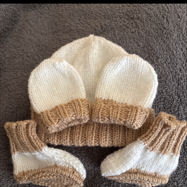 Beige and white hat mitts and Boottees 