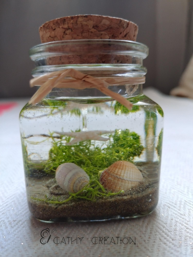 Fiole avec inclusion de coquillages 7cm