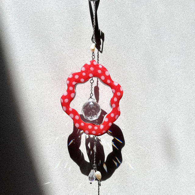 Attrape soleil rouge et blanc