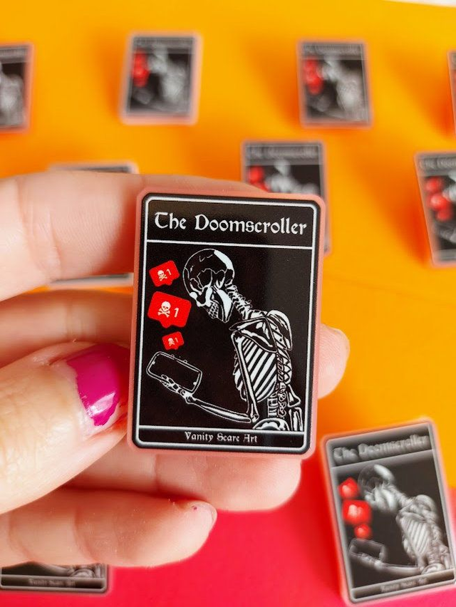 The Doomscroller Pin Badge