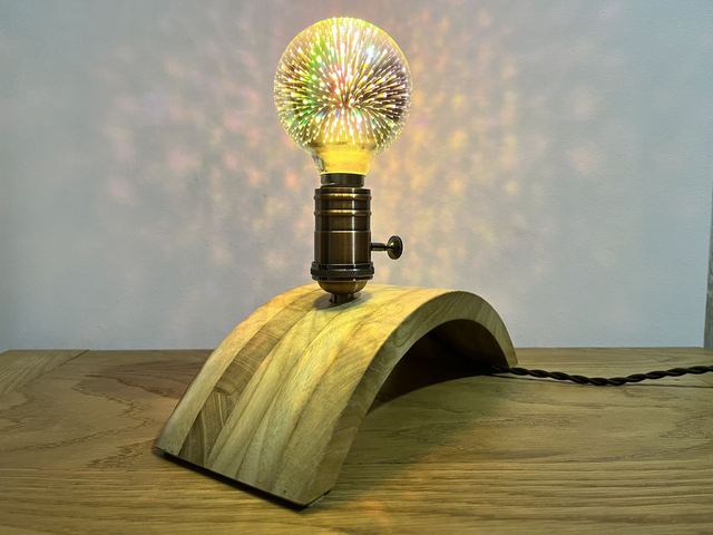 Decorative lamp made of Paulownia wood with a 3D light bulb.