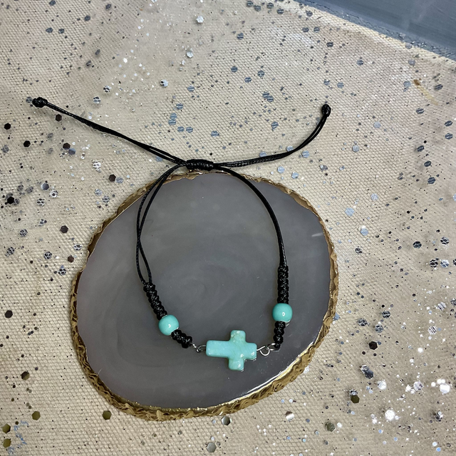 Adjustable bracelet with quartz cross. Fully adjustable cord bracelet. 