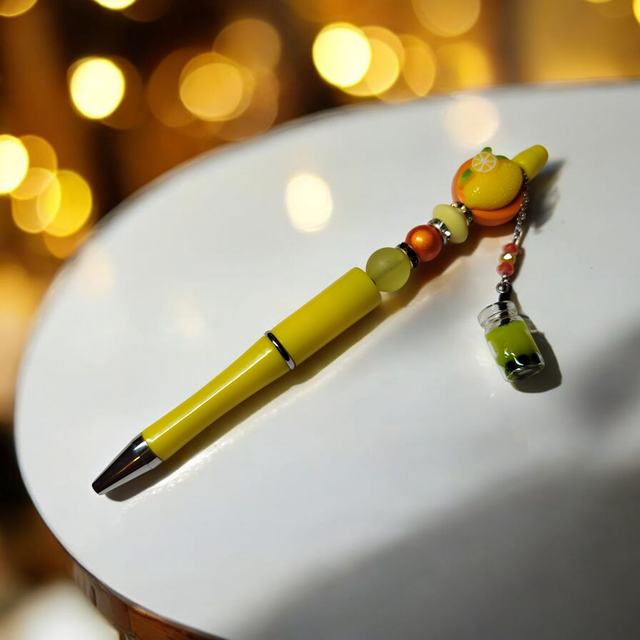 Stylo perles jaune orange