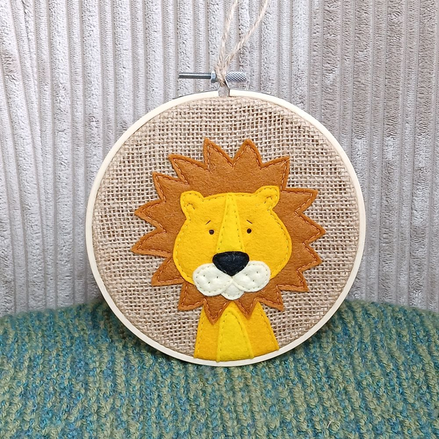 Safari Range, hoop art. Fully hand-sewn wool felt designs on hessian. Lion design. 