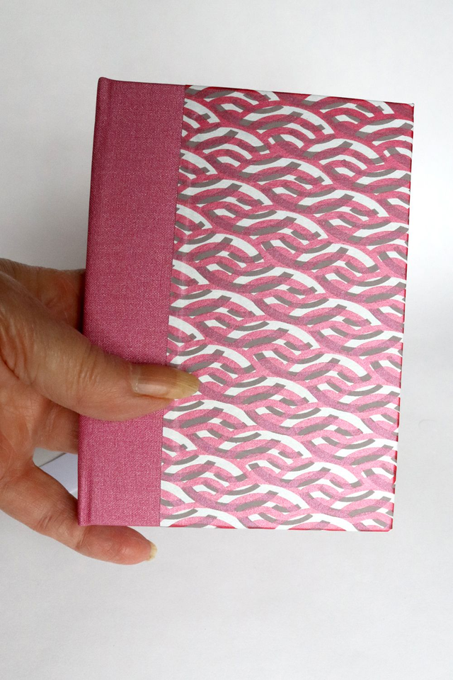 Lined notebook with pink patterned paper cover