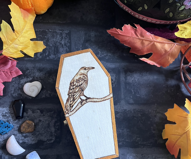 Beautiful coffin box with Crow design and antique gold border 