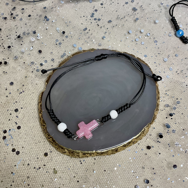 Adjustable bracelet with quartz cross. Fully adjustable cord bracelet.