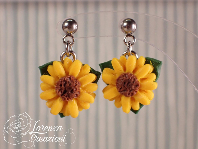 Orecchini pendenti girasole
con foglie