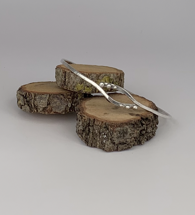 Delicate silver bangle.