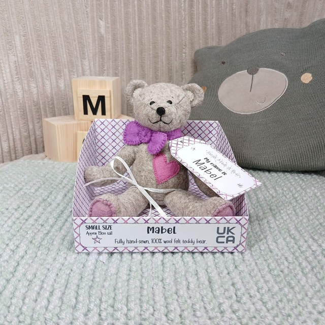 Mabel. Small size, handmade teddy bear. UKCA. Tray base packaging. Limited Edition Wool Felt. Brown. Purple. 