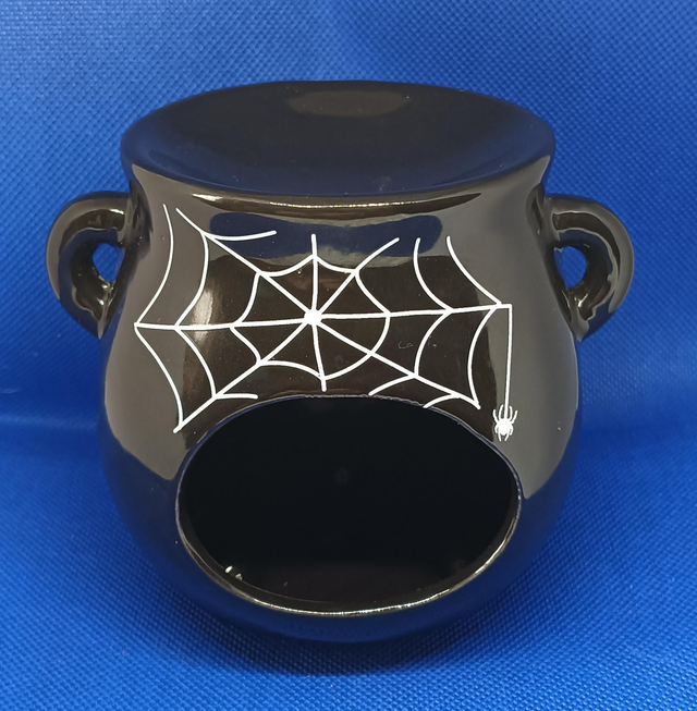 Black Oil Burner With Spider Web Design.