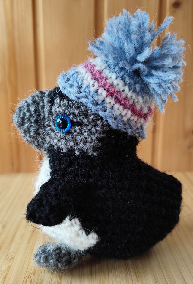 Sweetie the medium size baby puffin with rainbow hat (pale colours), (made from Icelandic wool yarn)
