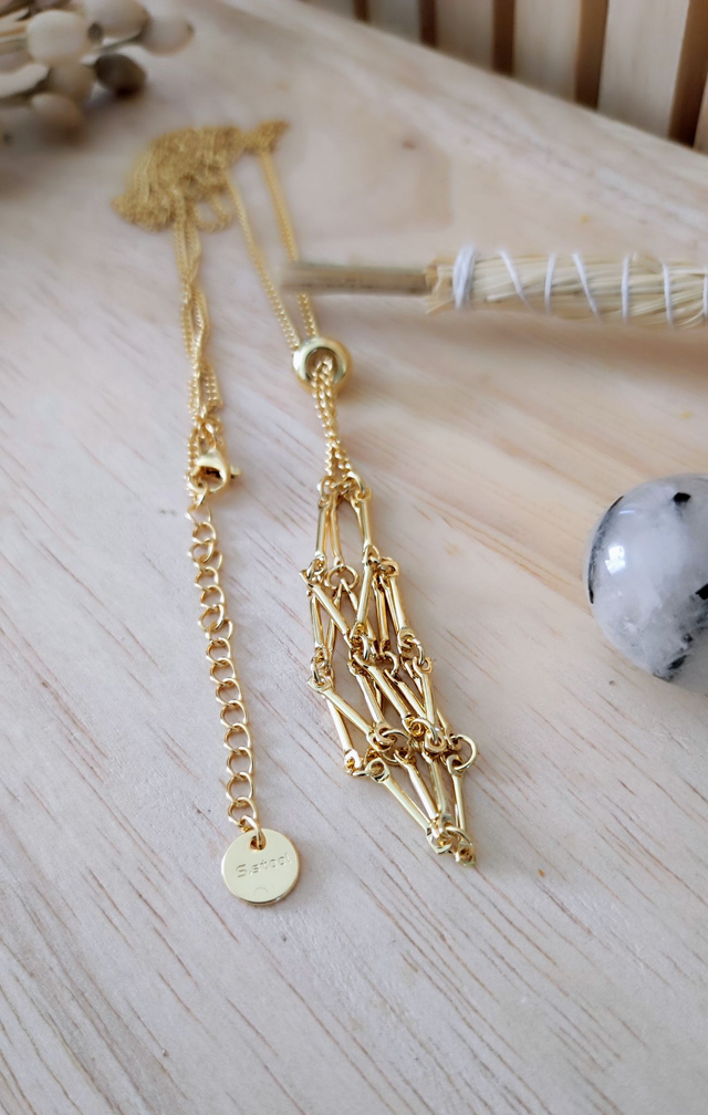 Porte collier pierre acier doré 50 cm