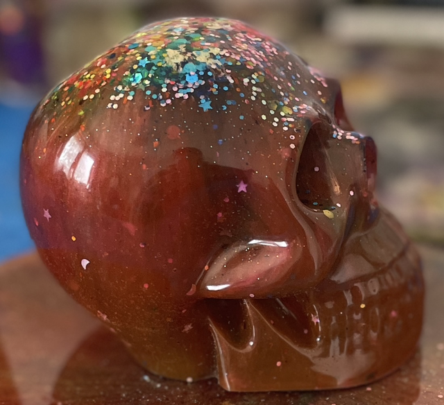 Bright multi coloured large resin skull
