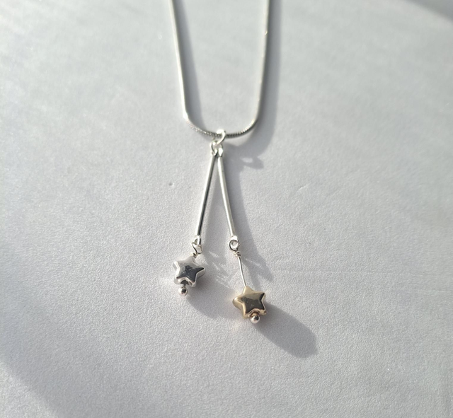 Contacting Star Necklace