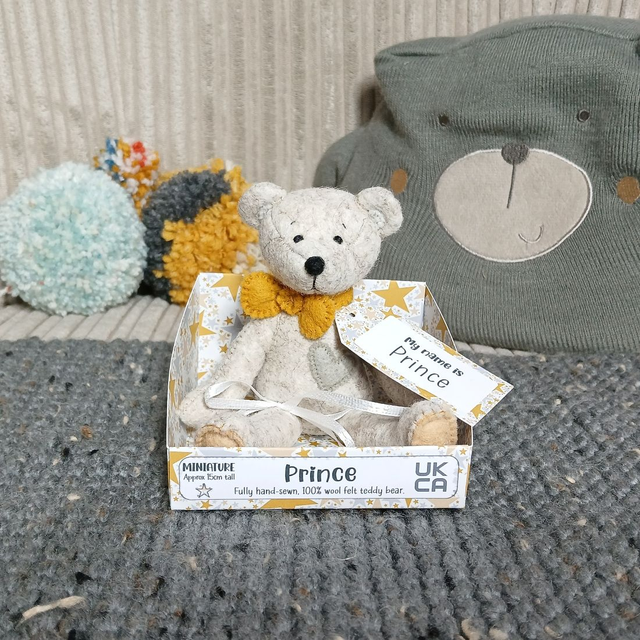 Prince. Miniature size, handmade teddy bear. UKCA. Tray base packaging. Standard Wool Felt. Beige. Mustard. Grey. Sand.
