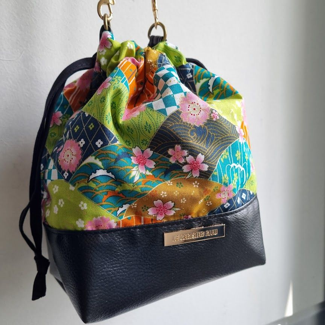 Baluchon "Fanny" vert & simili cuir noir