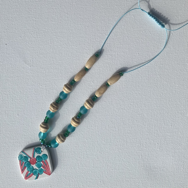 Hand made hand painted air dry clay beaded pendant