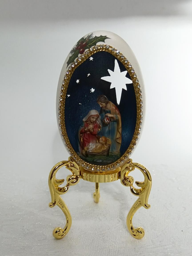 Nativity in a Goose egg cut out star's and a holly