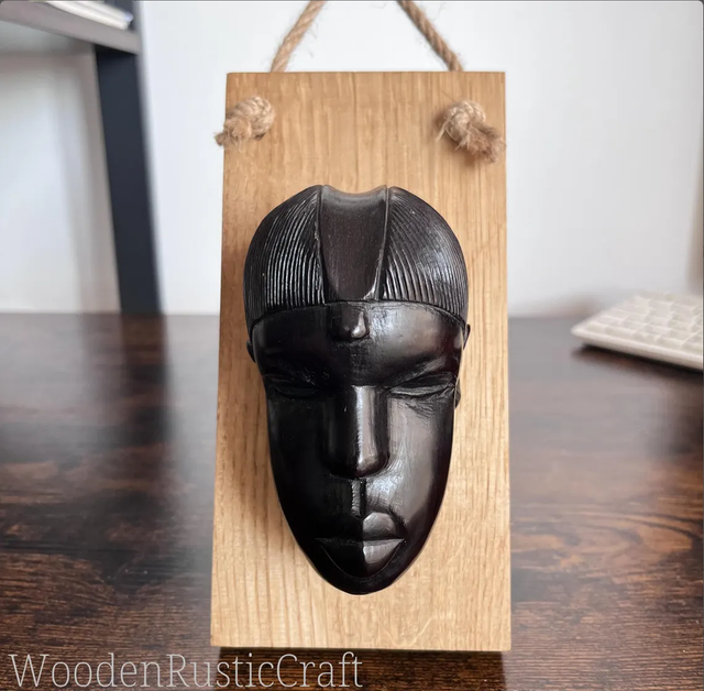 Pair of Ebony Head Sculptures on Oak Wall-Mounting Bases