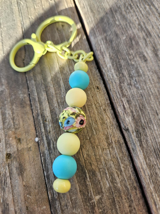 Porte clefs jaune fleurs