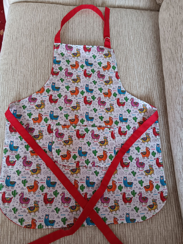 Childs Kitchen Play Apron Llama Patterned Cotton Fabric with Front pocket and red lining, waist ties and adjustable neck ties