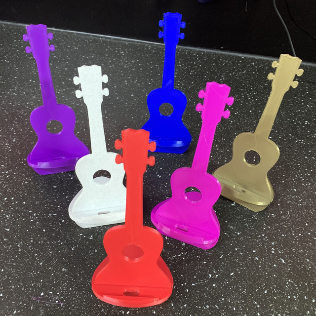 Phone/tablet stand, but shaped like a ukulele!