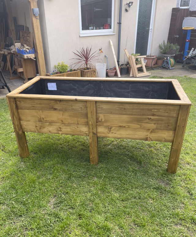 Raised wooden planter for flowers or vegetables with planting depth approx 42cm.v