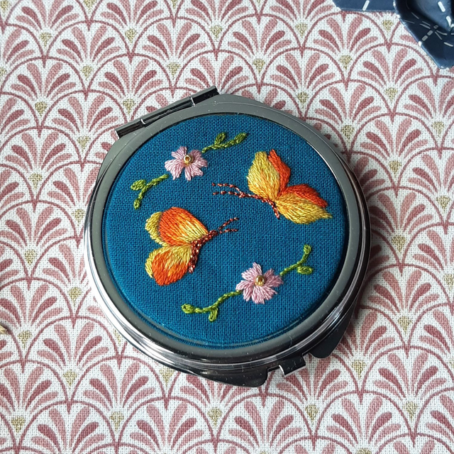 Miroir papillons orangés