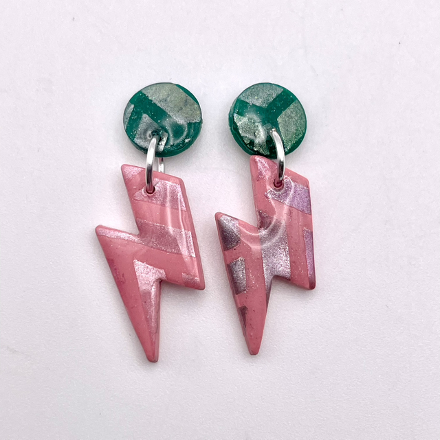 Small pink and green lightning bolts