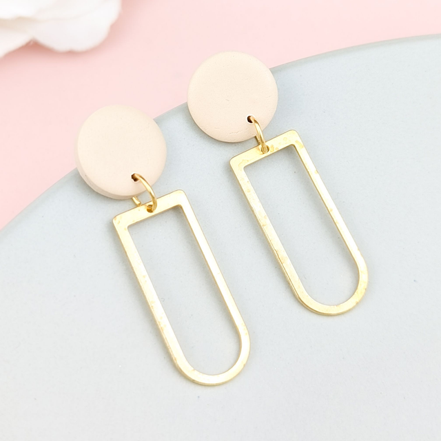 Neutral stud and brass drop earrings