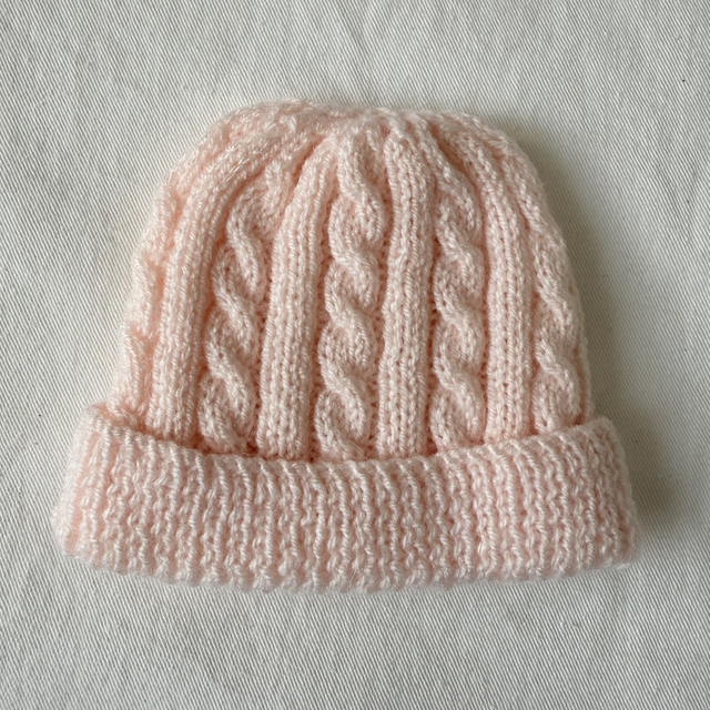 Pink cable knit hat