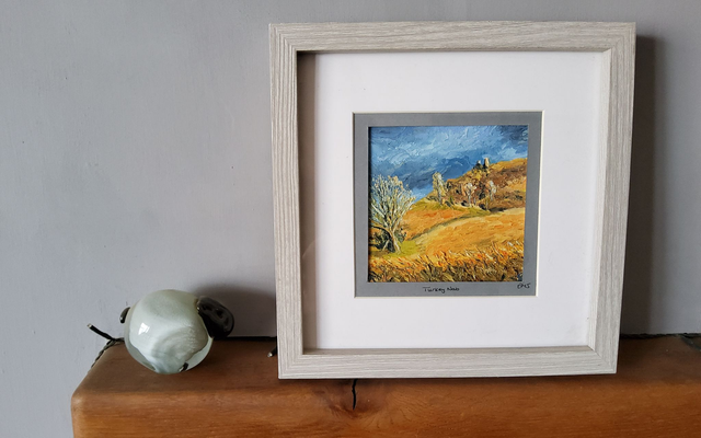 Framed original oil painting of post storm light over Turkey Nab, North York Moors. 