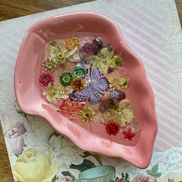 Pink leaf ring trinket tray with pressed flowers.