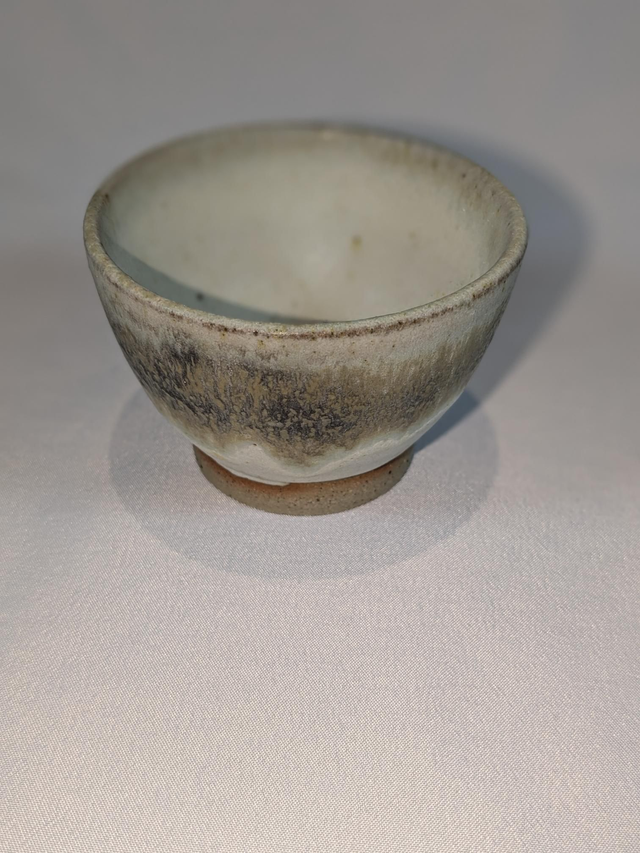 Small turquoise and light oatmeal bowl