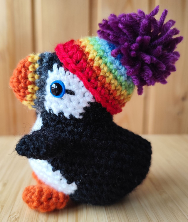 Fluffy the puffin with rainbow hat, small size (made from merino wool yarn)