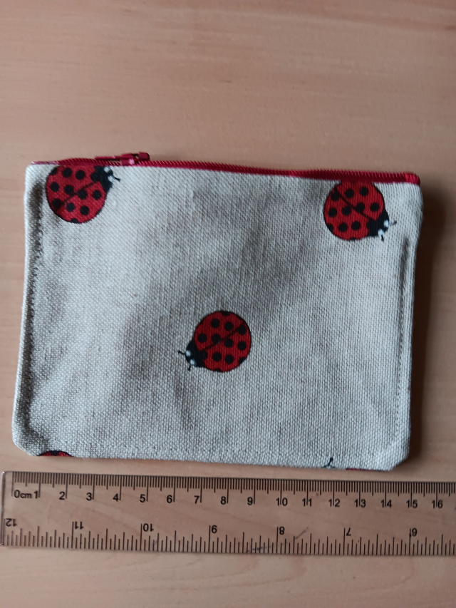 Beige Fabric Purse with ladybirds and Red Waterproof Lining and red Zip