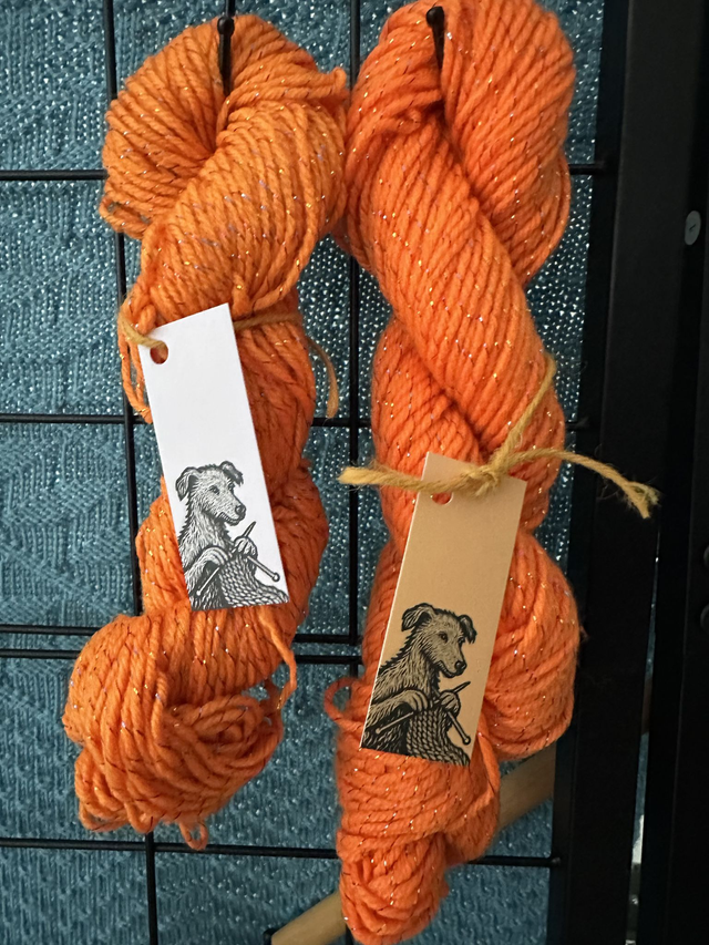 Orange spun with metallic &amp; reflective strands DK