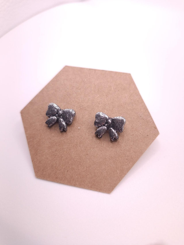 Puces noeud papillon argenté 