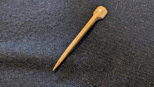 Silver studded hardwood pin