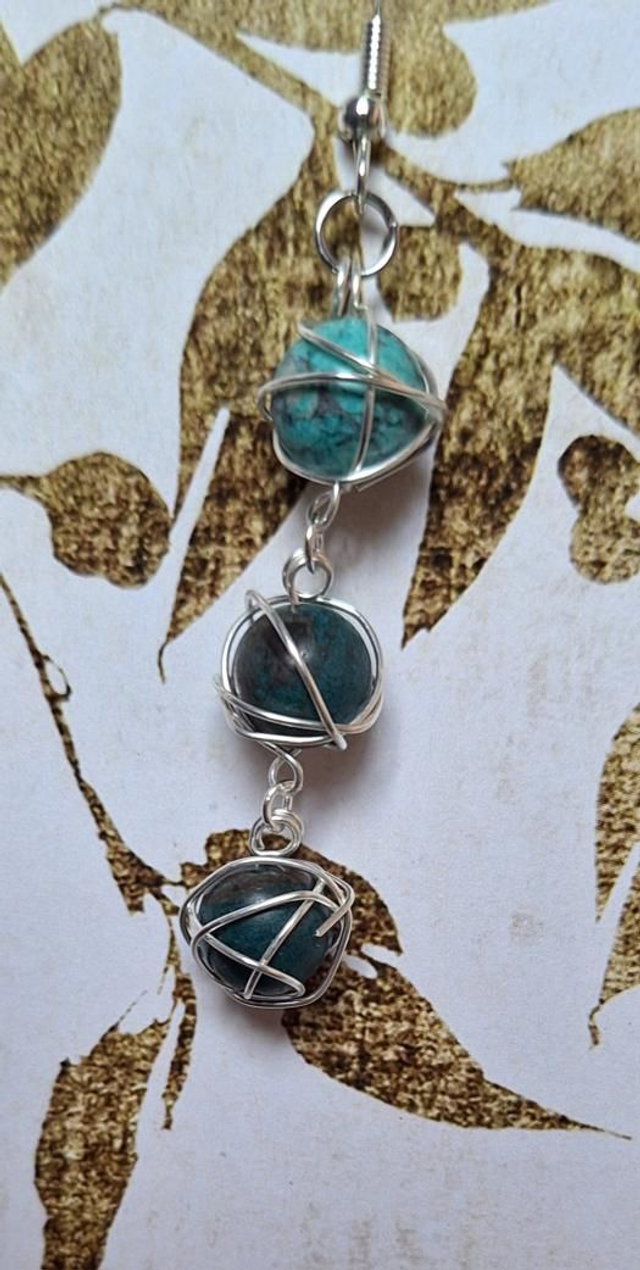 The fates in silver with American turquoise, single earring