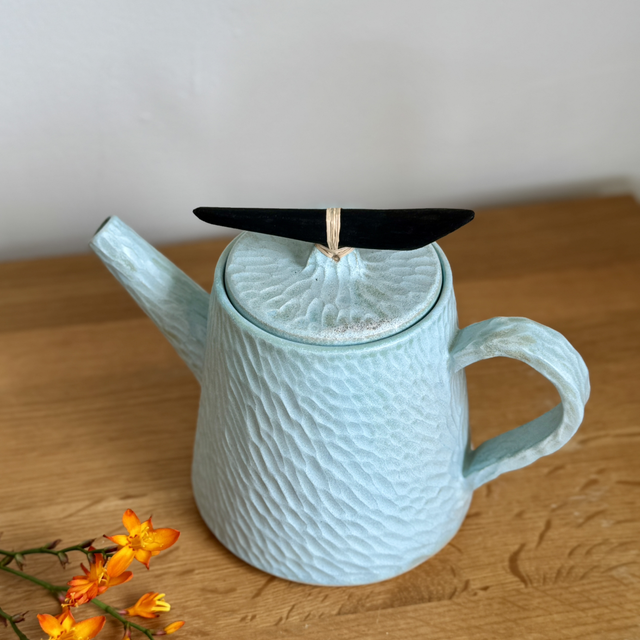 Hand carved teapot