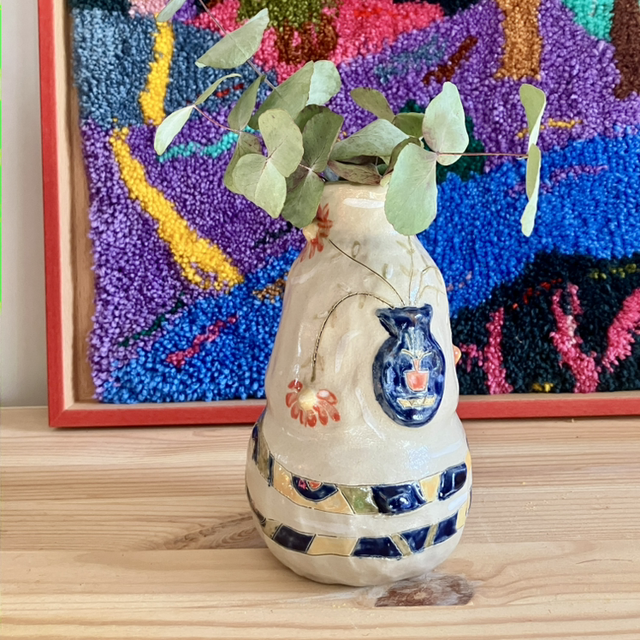 Vase with a textured snake and a vase with flowers