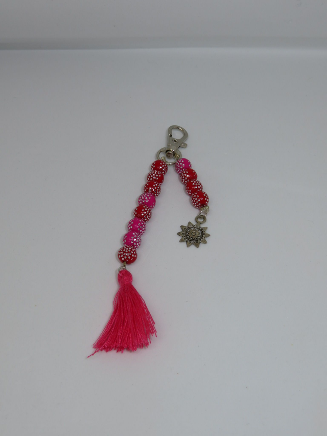 Porte clés rouge et rose et pompon