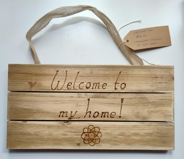 Welcome sign with geometric design 