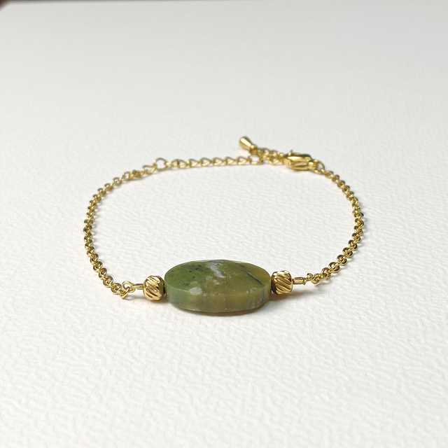 Bracelet ESSENTIEL, Péridot, acier chirurgical doré