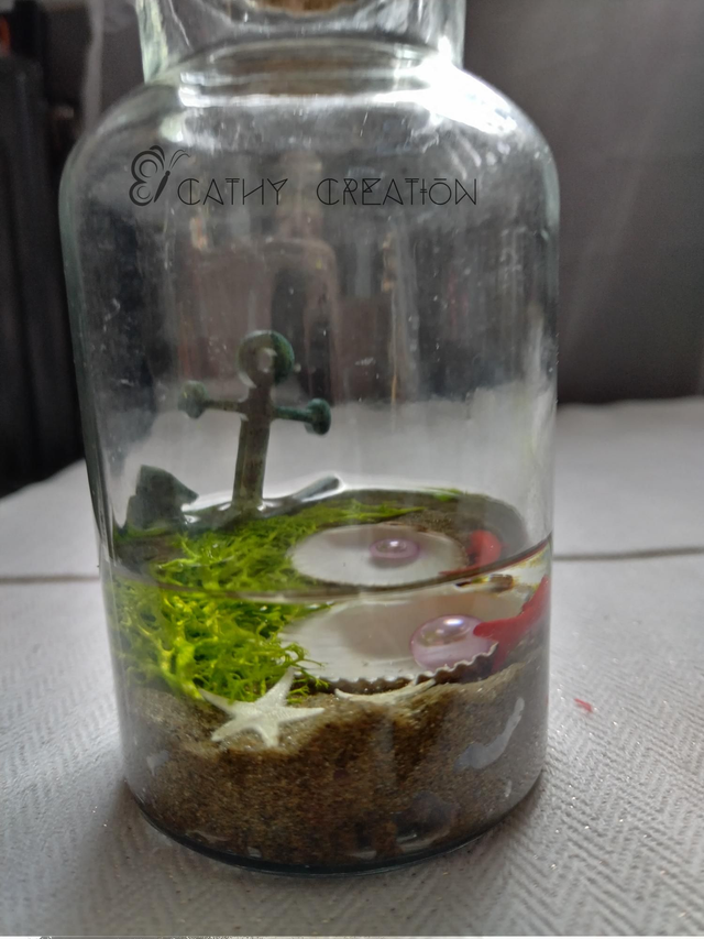 Flacon de 14 cm avec composition marine