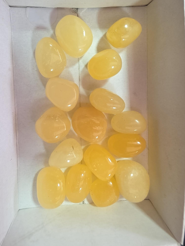 Orange calcite tunblestone 