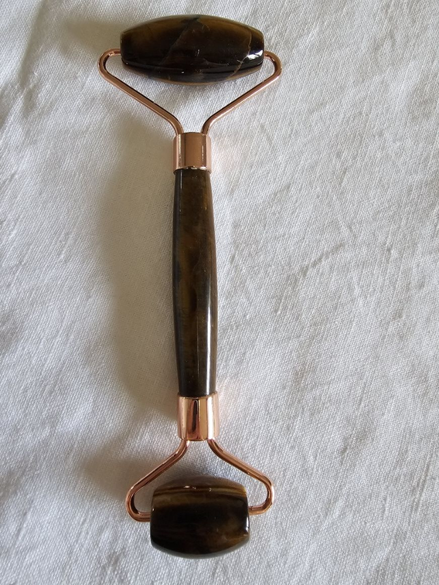 masseur facial œil de tigre 