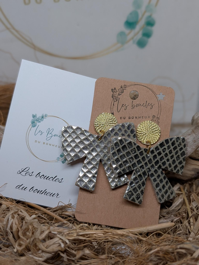 Boucles d'oreilles noeud sable dorée no012